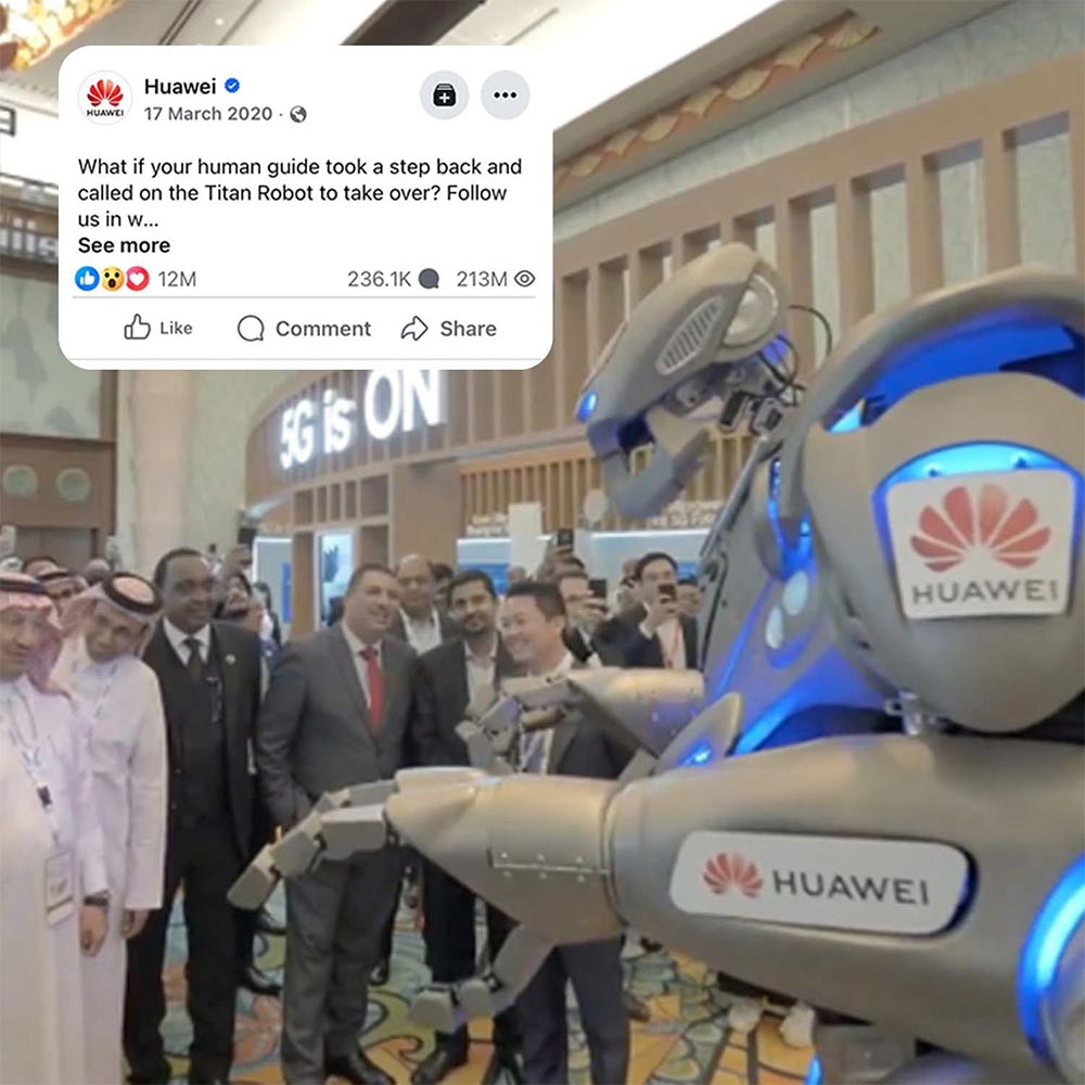 Titan the Robot stands in front of corporate professionals branded with the Huawei logo, with an infographic showing over 200 million views.