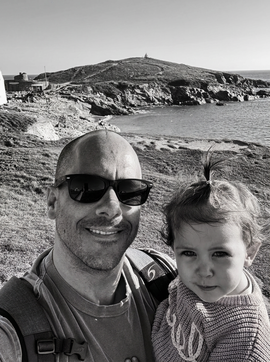Jamie Whittle with his daughter on the Cornish coast